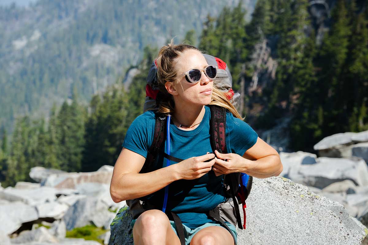 Smartwool Merino SS women's hiking shirt (sitting on granite)